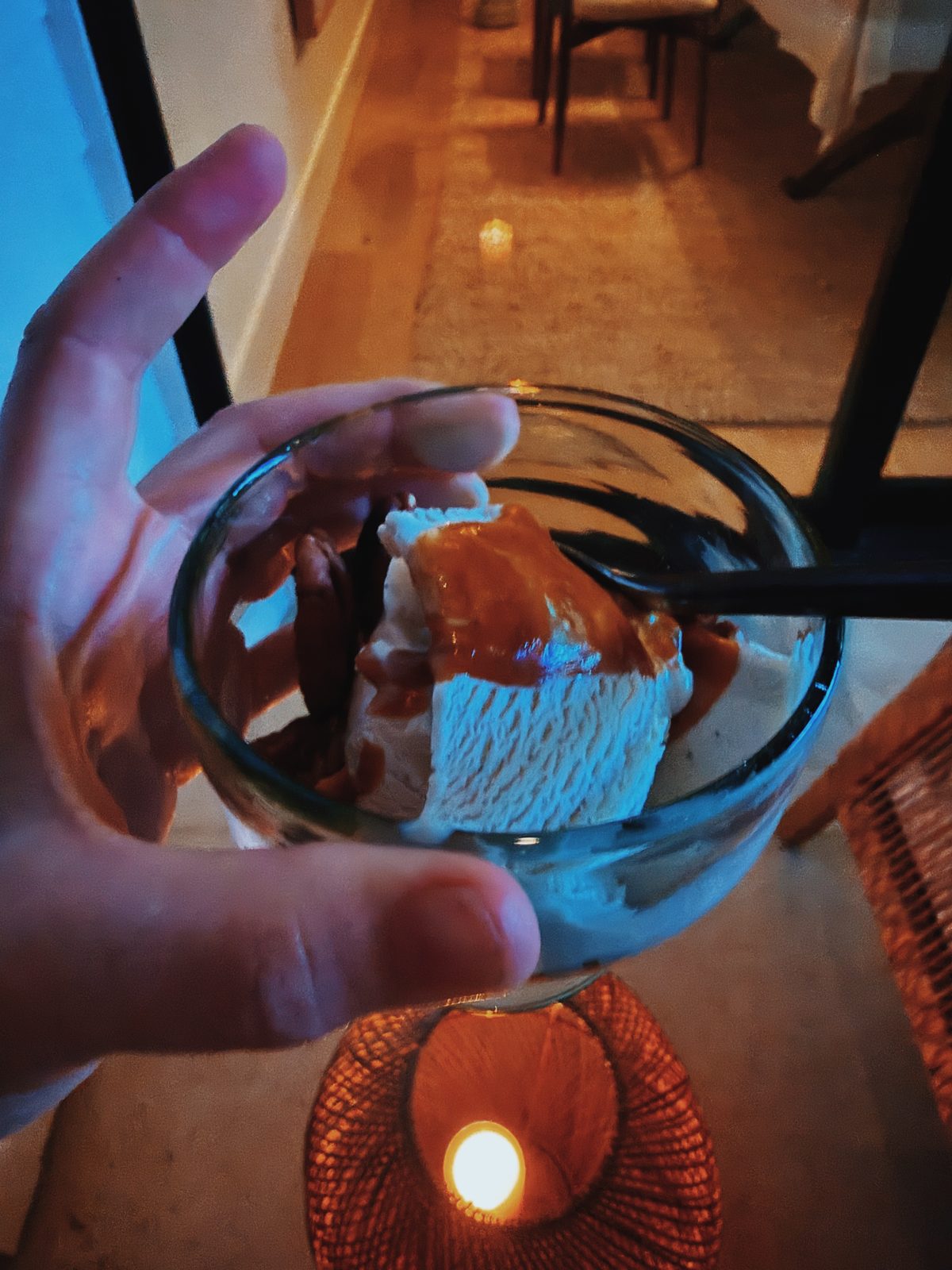 Ice cream with dulce de leche by candlelight
