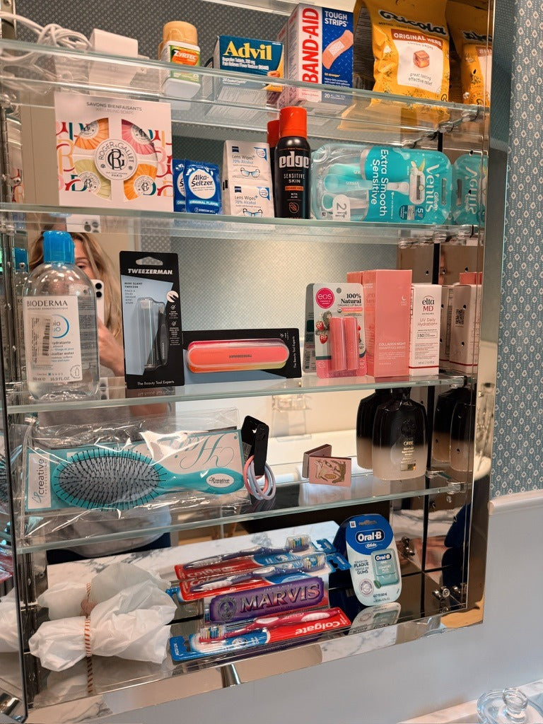 The guest bathroom cabinet, stocked with everything a guest forgets