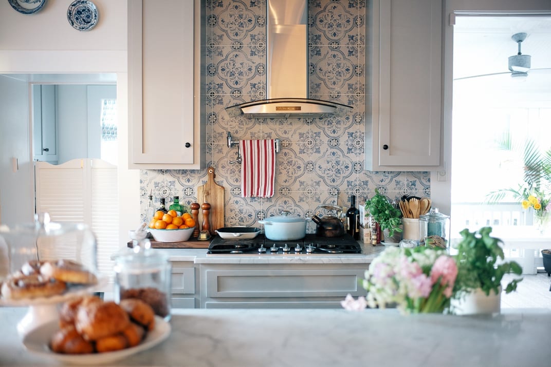 A kitchen with blue and white tiles