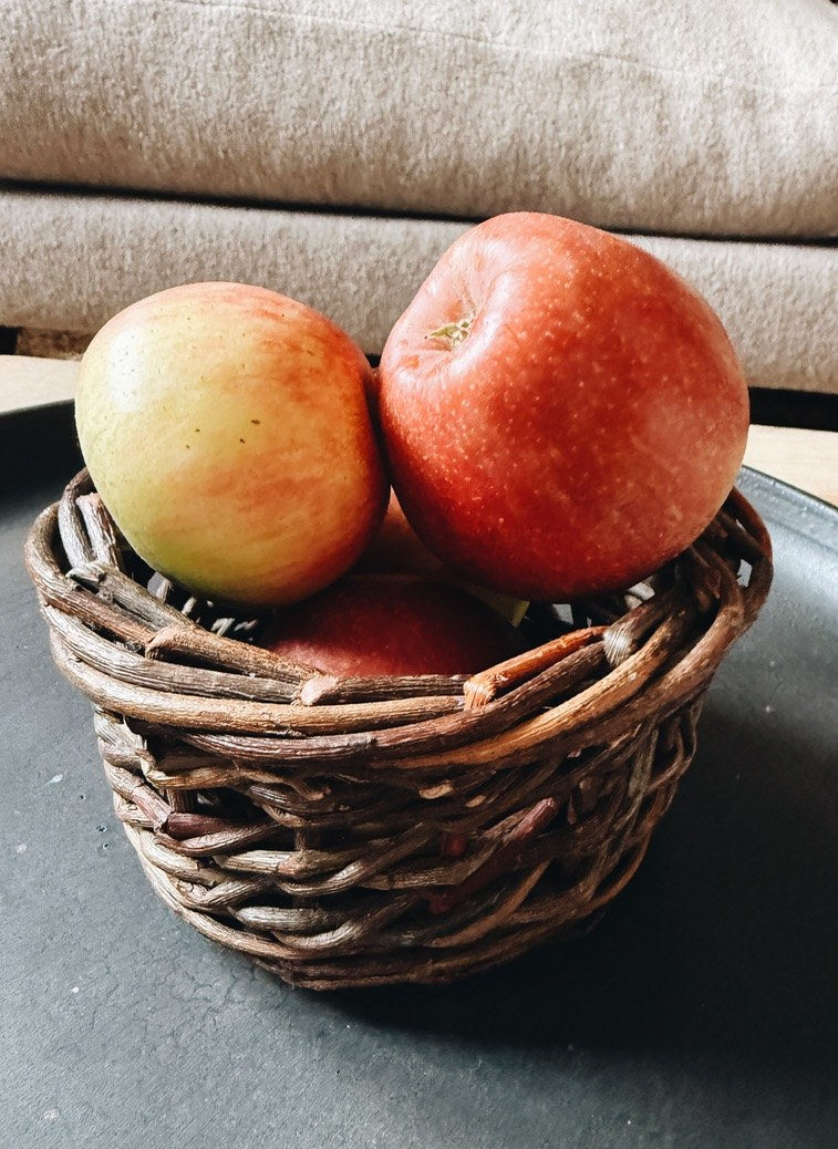 Two apples in a little basket