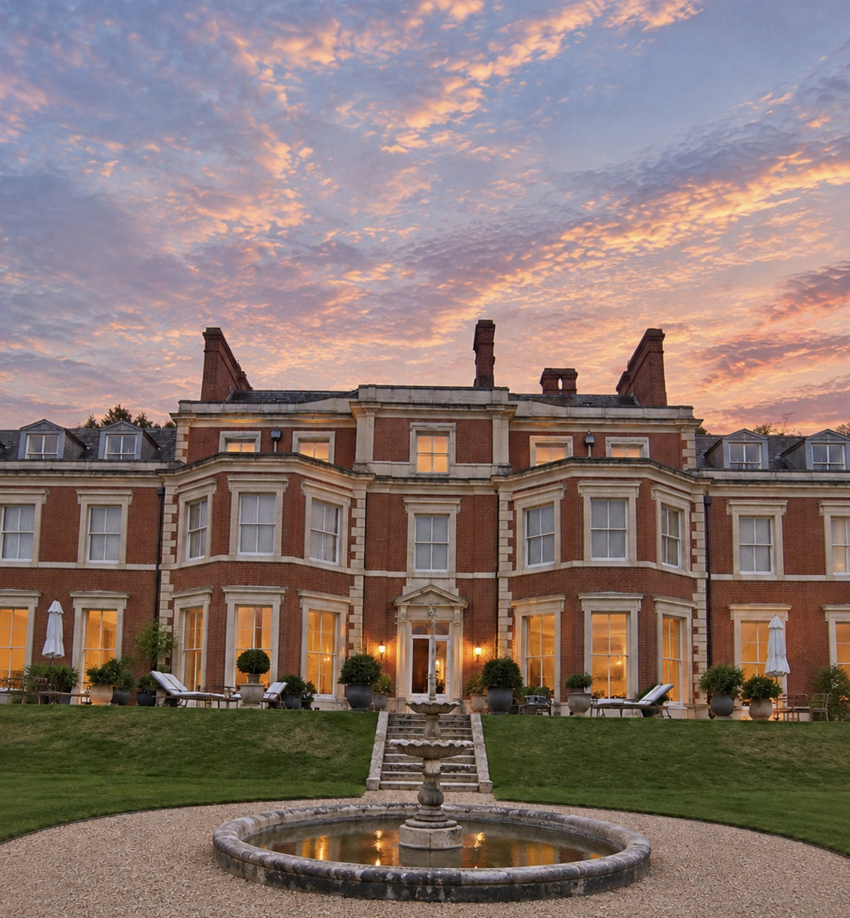 Heckfield Place at sunset, the fountain in front of the house