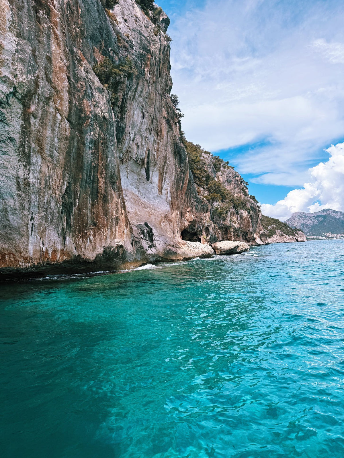 Limestone cliffs dropping into turquoise water