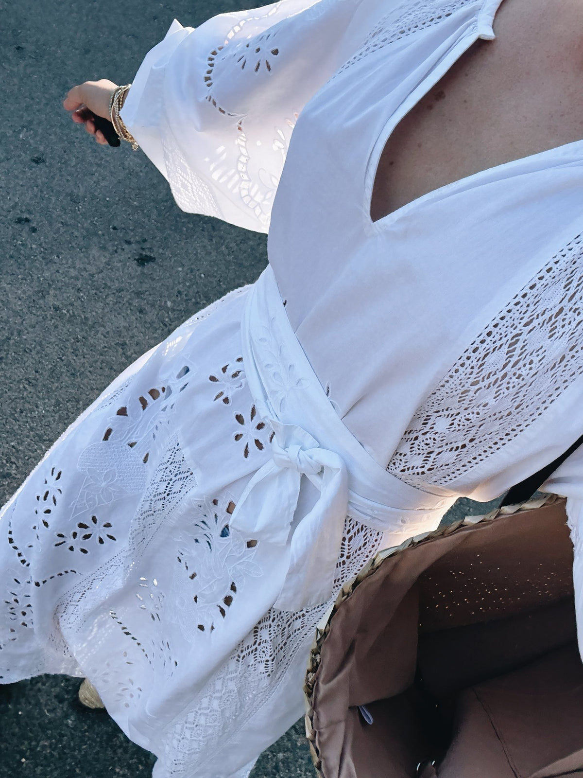 A white eyelet dress on the way to the market