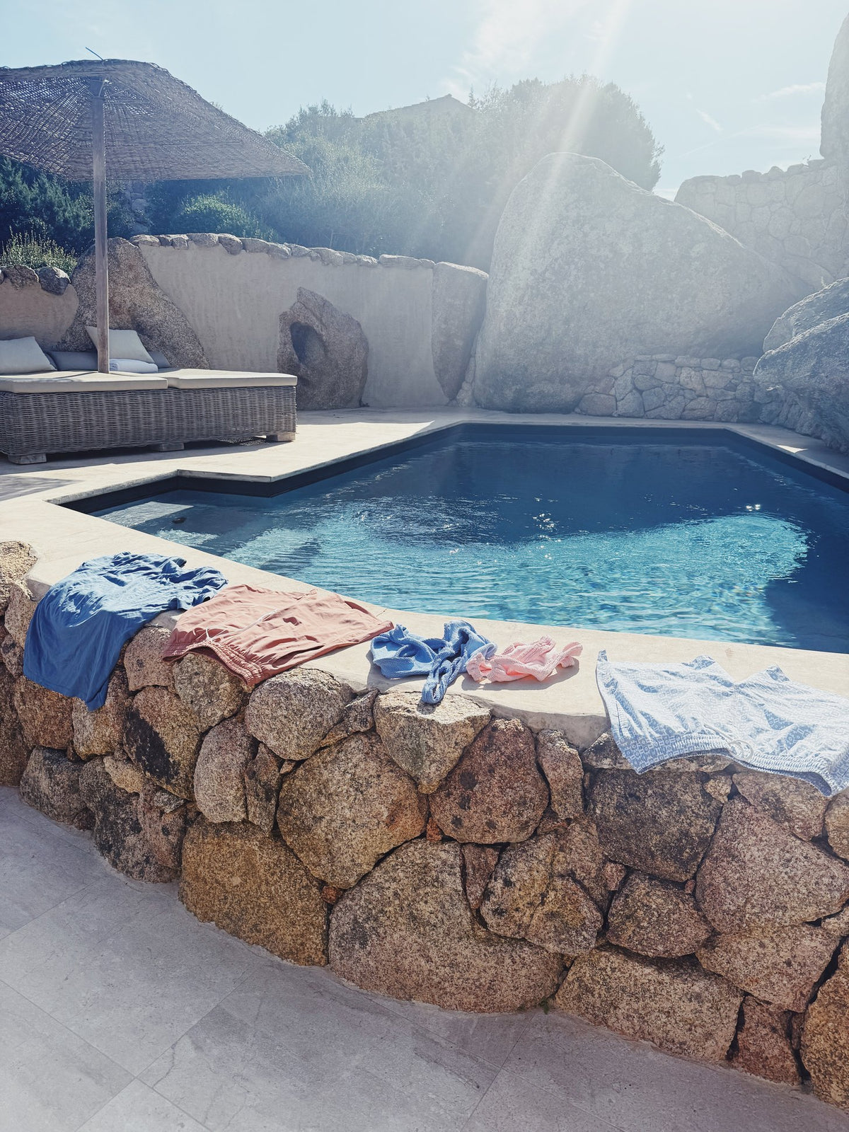 A stone-edged pool above the hills at Petra Segreta