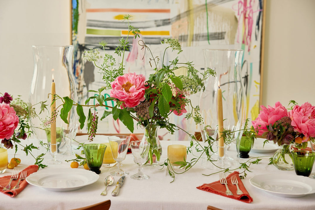 The Thanksgiving table set on Wednesday: tapers, peonies, green goblets and rust napkins