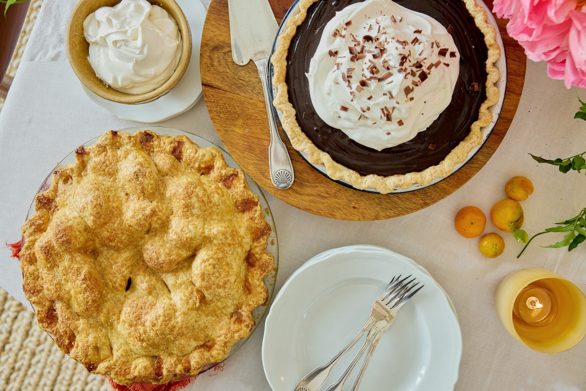 Apple pie and chocolate pie from above, whipped cream and clementines